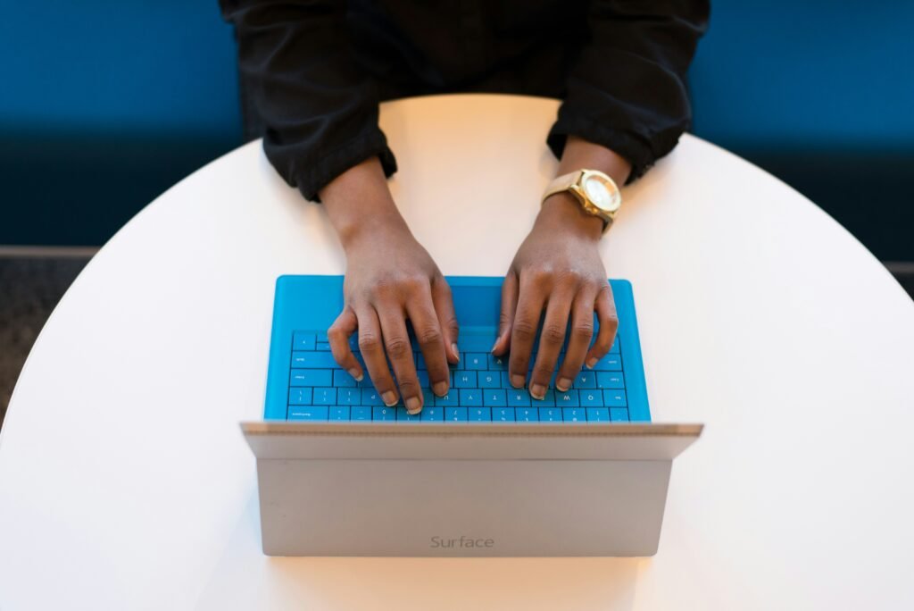 Hands typing on a keyboard